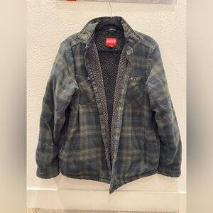 Coleman men's flannel shirt jacket with a green plaid pattern and sherpa lining